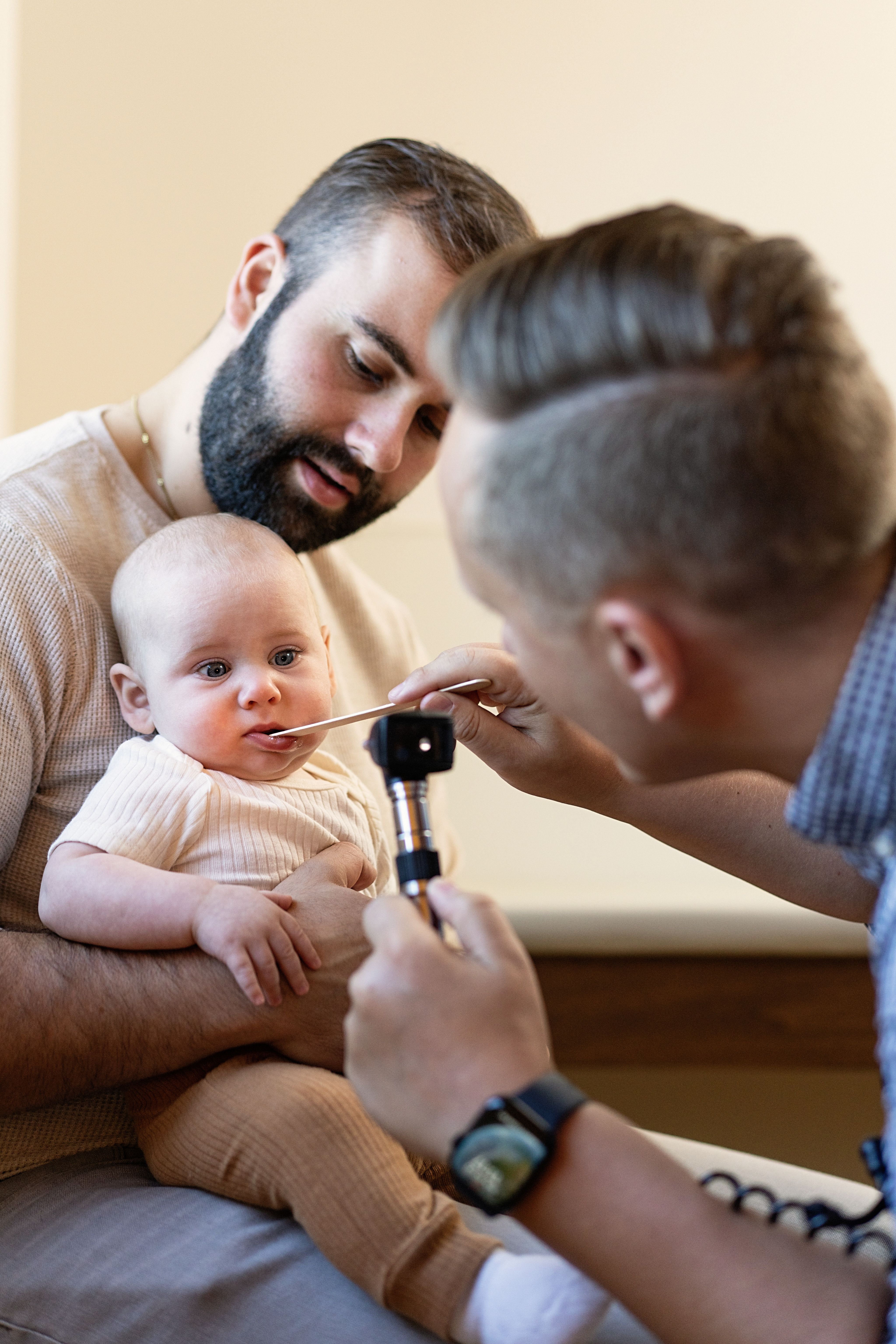 Image of therapist and child coloring at table.