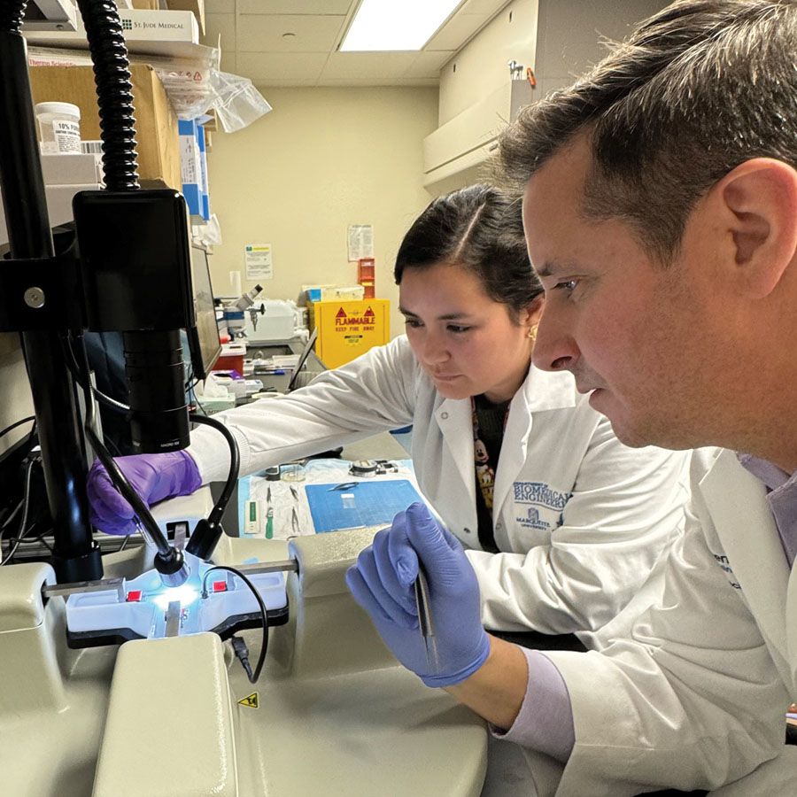 Photo of John LaDisa and Carla Guzman in the lab