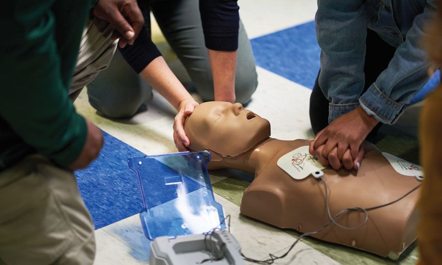 Photo of AED being used in training session